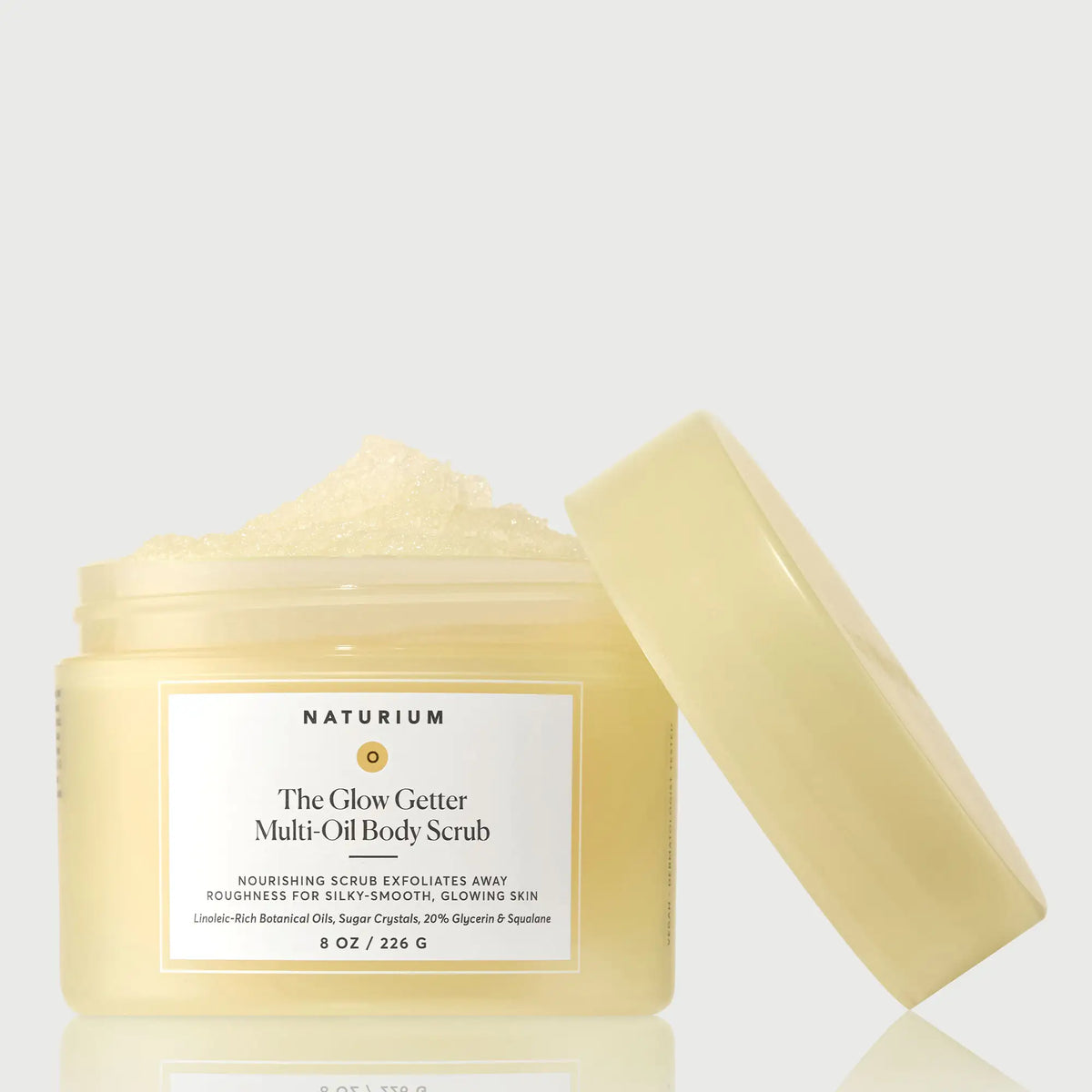 the-glow-getter-multi-oil-body-scrub-c6 NATR-40028-GlowGetter-Multi-Oil-Body-Scrub-Front-CapOff-bonebkgd.webp
